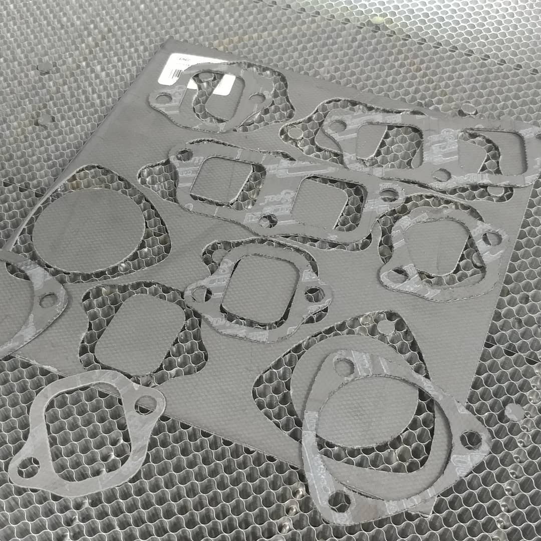 Laser cut custom exhaust gaskets digitized from @catoscustomupholstery supplied cardboard templates. It's not a huge deal for this size but we don't use a simple photo to create our drawings due to lense distortion on larger templates. We do a full color scan with our 3d scanner over a reference grid to double check scale.